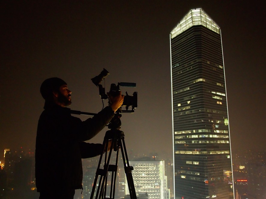 Cinema camera setup filming the Beijing skyline at night