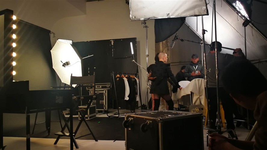 Commercial production set in Beijing with lighting and client-facing crew structure