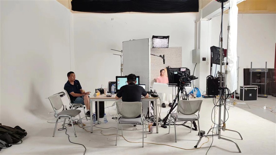 Beijing equipment setup with camera, monitor and lighting in a controlled studio environment